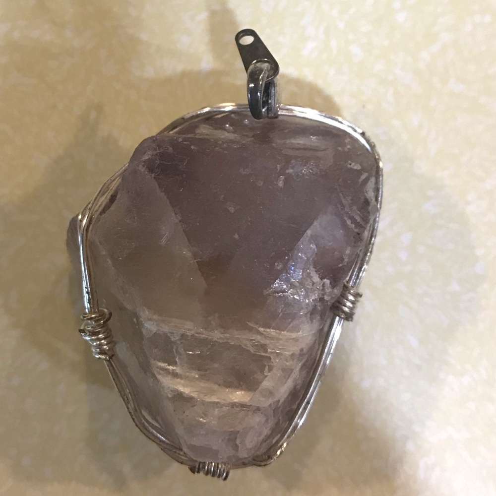 Wire wrapped crystal pendant. Made by hand.